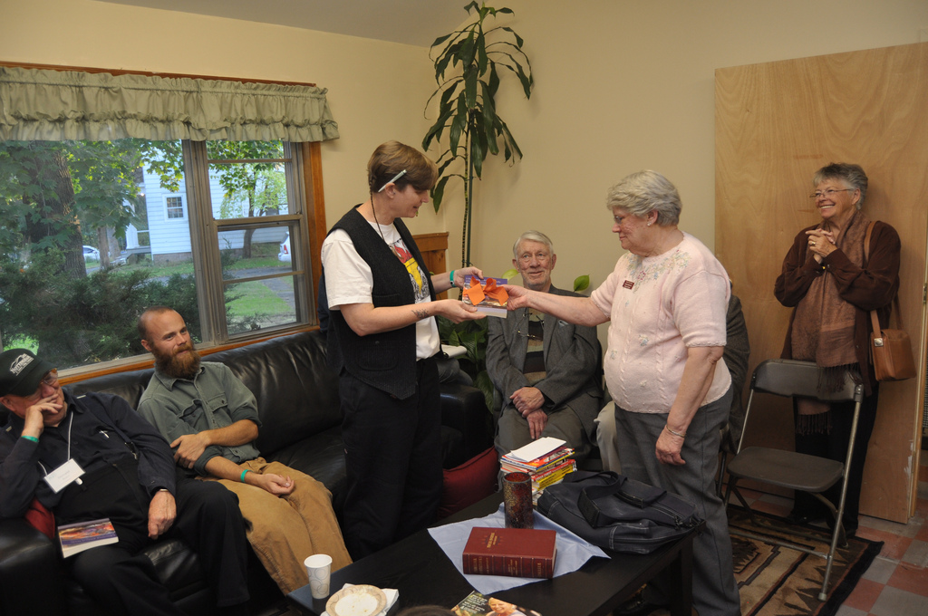 Laurel Dykstra gives CLBSJ librarian Joanna Meckley a copy of Liberating Biblical Study for the library's collection